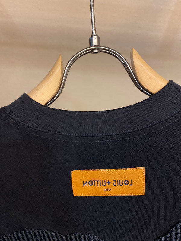 Side profile of Louis Vuitton luxury clothing with runway-inspired design