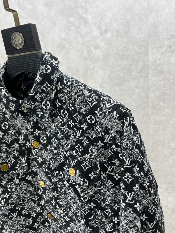Flat lay presentation of Louis Vuitton luxury clothing with label-forward styling