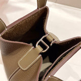 Side view of poised structured handbag