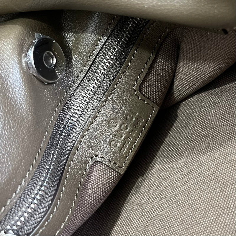 Side profile of premium signature women's handbag – women's everyday handbag