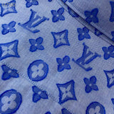 Side profile of Louis Vuitton luxury clothing with signature branding