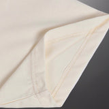Side profile of Gucci luxury clothing with signature branding
