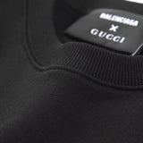 Close-up detail shot of Gucci luxury clothing with signature branding