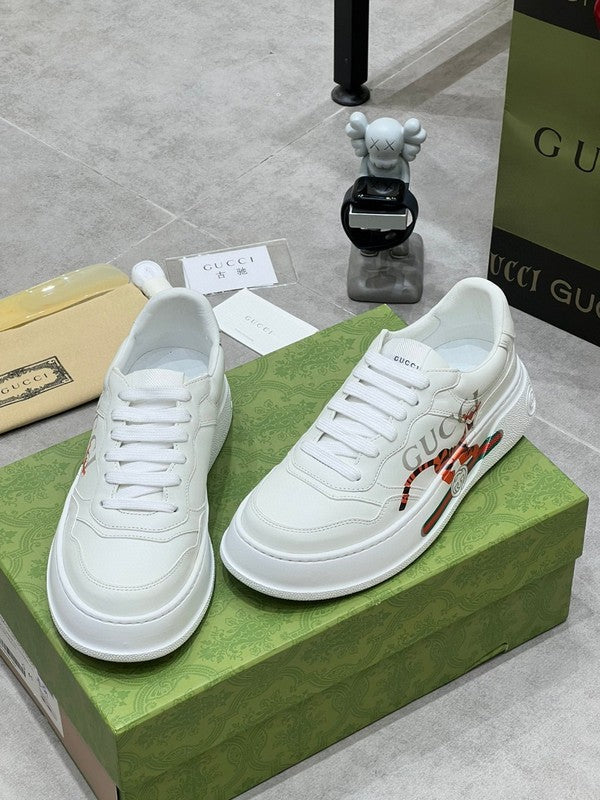Side profile of Gucci neutral cream sneakers signature lace-up style
