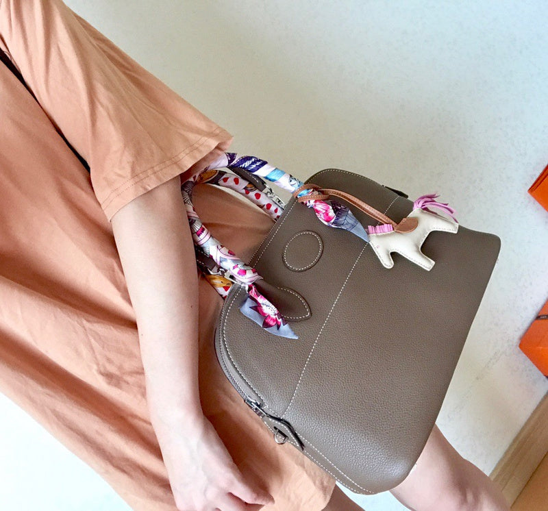 Side view of tailored structured handbag