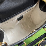 Close-up detail of signature elevated women's handbag – women's designer-style accessory