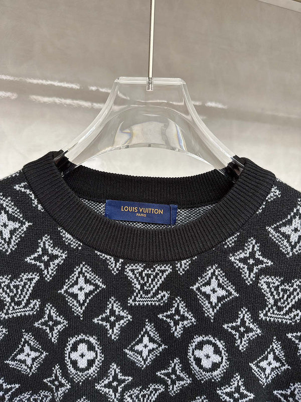 Close-up detail shot of Louis Vuitton luxury clothing with logo-detail design