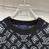 Close-up detail shot of Louis Vuitton luxury clothing with logo-detail design