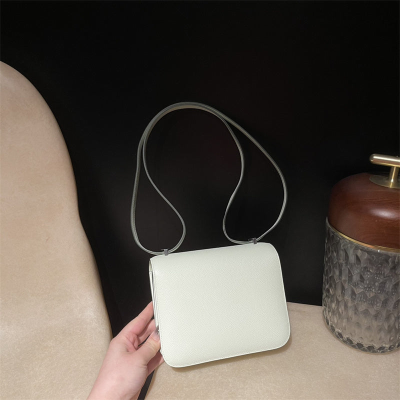 Side view of clean-lined structured handbag