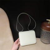 Side view of clean-lined structured handbag