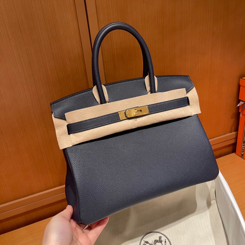 Side view of curated structured handbag