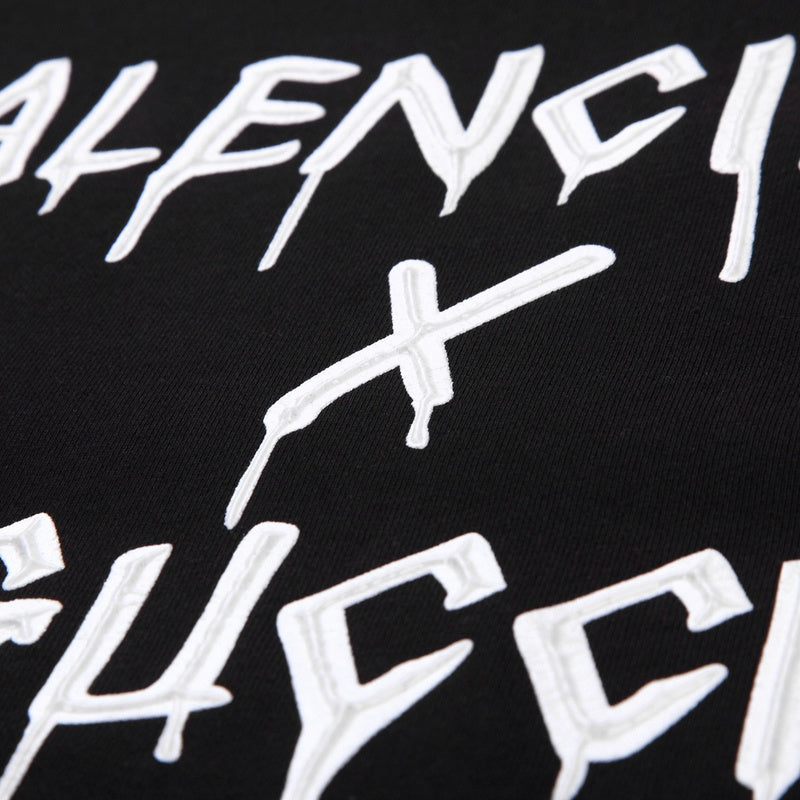 Front view of Gucci luxury clothing with signature branding