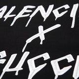 Front view of Gucci luxury clothing with signature branding