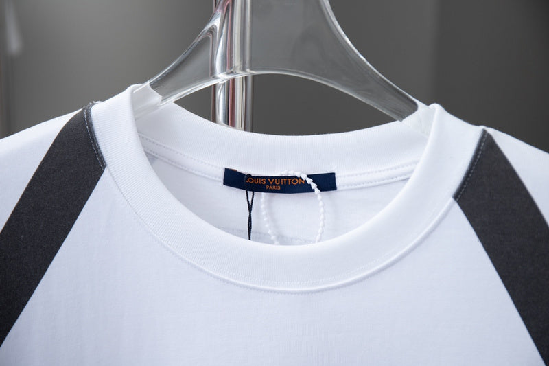 Close-up detail shot of Louis Vuitton cotton t-shirt with signature branding