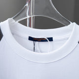 Close-up detail shot of Louis Vuitton cotton t-shirt with signature branding