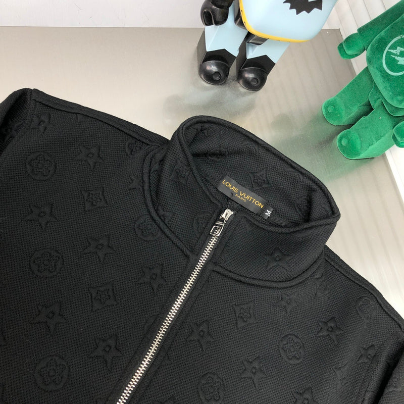 Close-up detail shot of Louis Vuitton luxury clothing with signature branding