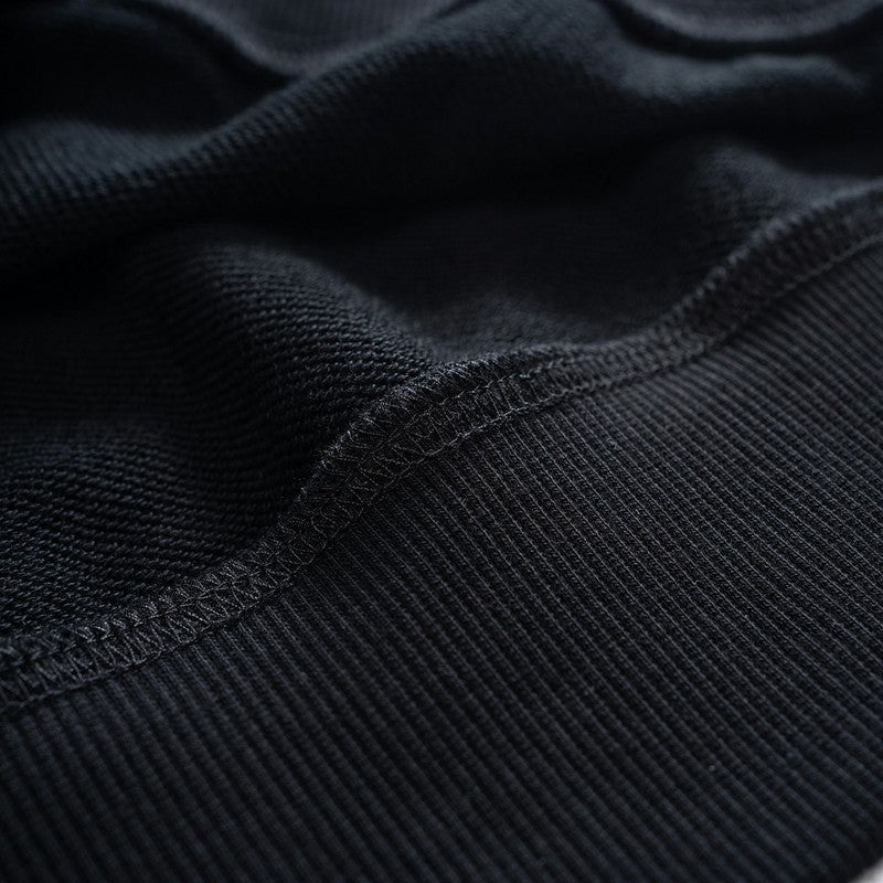 Flat lay presentation of Louis Vuitton luxury clothing with streetwear-inspired cut