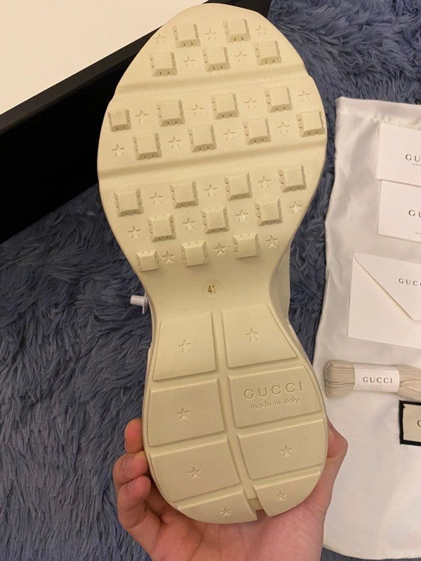 Side profile of Gucci stone beige sneakers classic court silhouette