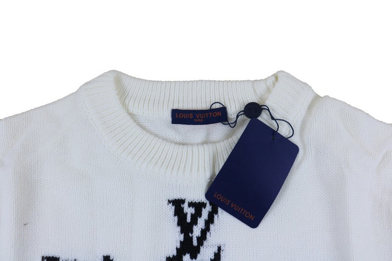 Close-up detail shot of Louis Vuitton luxury clothing with logo-detail design