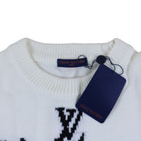 Close-up detail shot of Louis Vuitton luxury clothing with logo-detail design