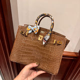 Side view of understated structured handbag