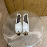 Louis Vuitton Beige Platform Heels - Close-Up Texture View