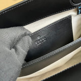 Side profile of chic refined women's handbag – women's luxury accessory