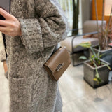 Side view of sophisticated structured handbag