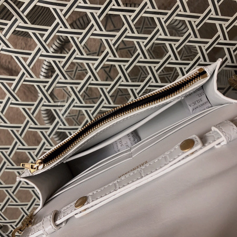 Side profile of chic polished women's handbag – women's statement bag