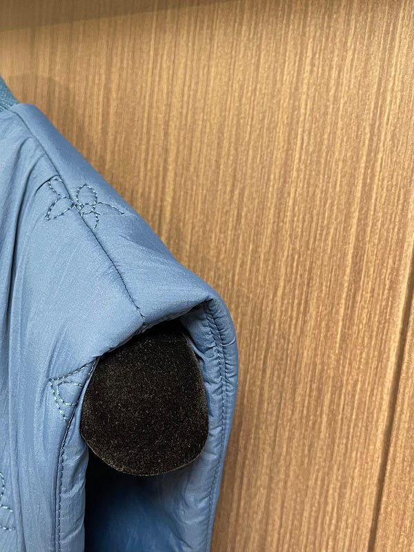 Side profile of Louis Vuitton luxury clothing with logo-detail design