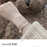 Lifestyle view of Van Cleef & Arpels unisex jewelry piece