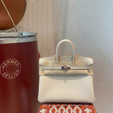 Side view of fluid structured handbag