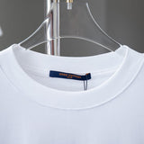 Close-up detail shot of Louis Vuitton cotton t-shirt with signature branding