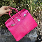 Side view of poised structured handbag