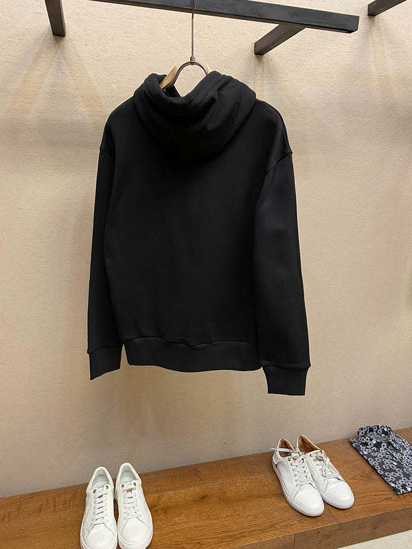 Side profile of Gucci luxury clothing with label-forward styling