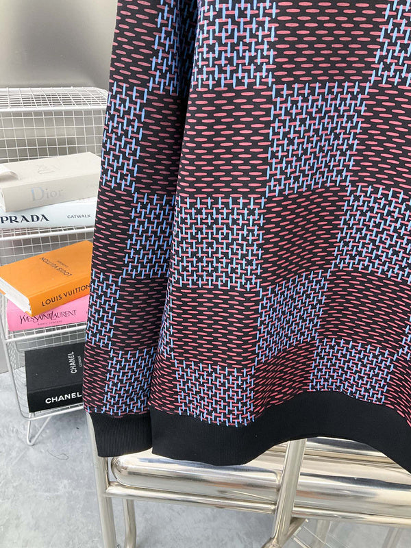 Back view of Louis Vuitton luxury clothing with label-forward styling