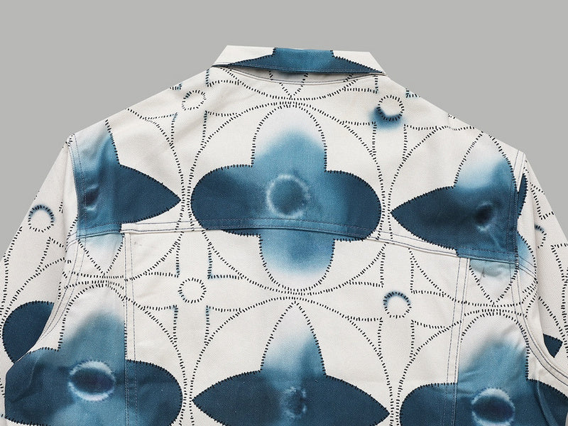 Flat lay presentation of Louis Vuitton luxury clothing with signature branding