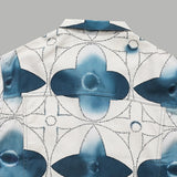 Flat lay presentation of Louis Vuitton luxury clothing with signature branding