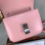 Handle and strap detail of modern structured women's handbag – women's statement bag
