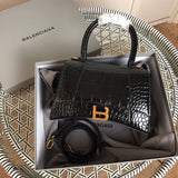 Side profile of classic sleek women's handbag – women's luxury accessory