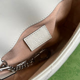 Side profile of refined classic women's handbag – women's statement bag