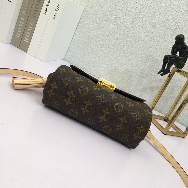 Styled lifestyle shot of structured refined women's handbag – women's premium purse