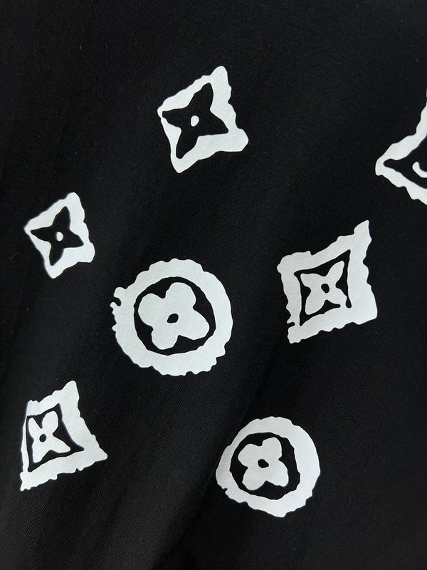 Flat lay presentation of Louis Vuitton luxury clothing with logo-detail design