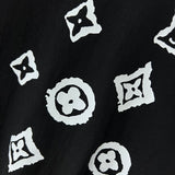 Flat lay presentation of Louis Vuitton luxury clothing with logo-detail design