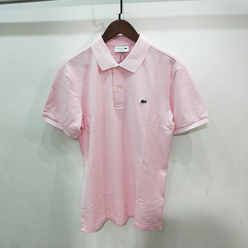 Flat lay presentation of Lacoste luxury clothing with monogram-inspired silhouette
