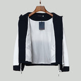 Close-up detail shot of Louis Vuitton luxury clothing with label-forward styling