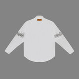 Close-up detail shot of Louis Vuitton luxury clothing with monogram-inspired silhouette
