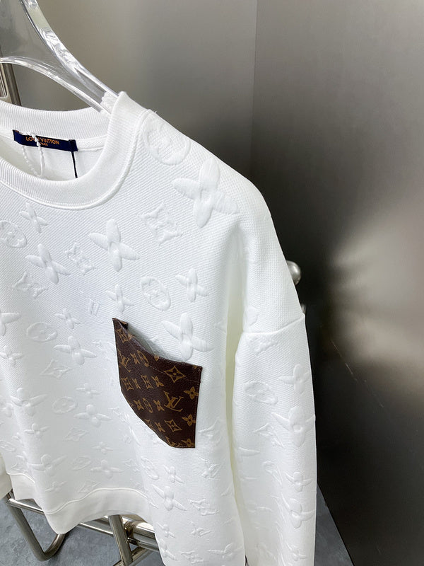 Full styled look of Louis Vuitton luxury clothing with label-forward styling