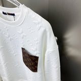 Full styled look of Louis Vuitton luxury clothing with label-forward styling