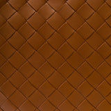 Close-up of Bottega Veneta clutches hardware and fine stitching